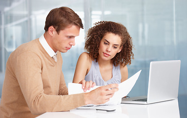 Image showing Document, discussion and business people in the office planning a legal agreement in collaboration. Professional, paperwork and team of lawyers in conversation with contract and laptop in workplace