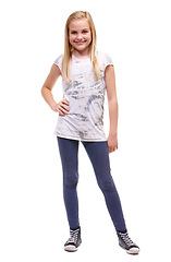 Image showing Kids, fashion and portrait of happy girl child in studio with trendy, cool or stylish outfit on white background. Smile, pose and face of happy kid model with casual, style or children clothes