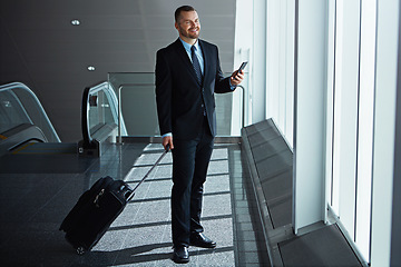 Image showing Smile, thinking or businessman in airport with phone, luggage or suitcase waiting to travel. Social media, happy entrepreneur or corporate worker texting to chat on mobile app on international flight