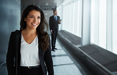 Image showing Walking, thinking or happy woman in airport for business trip with smile for a booking or commute. Opportunity, pride or corporate worker in hall for holiday travel or journey on international flight