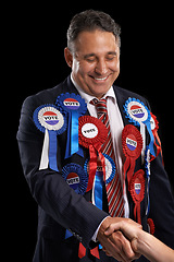 Image showing Man, vote and handshake with ribbon, happy and politician for support, government and politics. Elections, voter choice and representative for party, registration and democracy for voting register