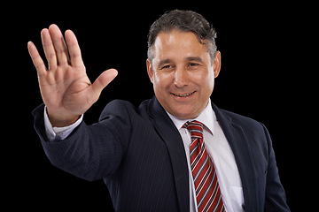 Image showing Government, happy politician and man in studio for wave, greeting and support on black background. Success, political campaign and person with hand gesture for leadership, pride and winning election