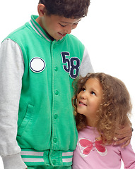 Image showing Smile, siblings and kids together for care, love or bonding in studio isolated on a white studio background. Happy brother, sister and children, girl and young boy with support, connection and family