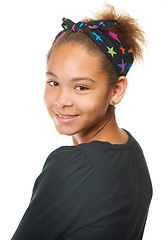 Image showing Child, portrait and smiling with beauty, hair and face with headshot, model and bandana. Girl, happy and isolated on studio background for fashion, teenager and clothes, confident and pose alone