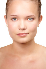 Image showing Teenager, portrait and natural skincare in studio for glow or clear, hygiene on white background. Female person, model and face for dermatology confidence for health wellness, calm shine or collagen