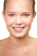 Image showing Teenager, portrait and skincare smile in studio for glow or clear, hygiene on white background. Female person, model and face for natural confidence for health wellness, calm clean shine or collagen