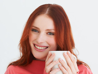 Image showing Smile, coffee and portrait of woman in a studio with positive, good or confident attitude. Happy, mug and young female model from Canada drinking cappuccino, latte or tea isolated by white background