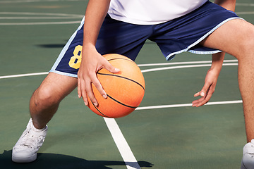 Image showing Man, legs and basketball on court for playing, training or workout with performance and wellness. Athlete, person or ball for sport, exercise or technique with fitness, skill and sports match outdoor