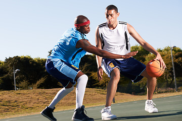 Image showing Men, player and basketball game or defense in court challenge team, dunk on rival. Male people, running dribble and score point in summer park in fitness clothes for competition, athlete for winning