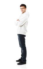 Image showing Portrait, arms crossed and man in hoodie for fashion isolated on white studio background. Confident young person, model and clothes, casual style or cool in trendy streetwear in Spain on mockup space