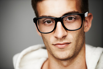 Image showing Closeup, portrait and man with glasses in studio for eye care mock up on gray background in Spain. Male model, person and vision with facial expression for spectacles by correction, lens or sight