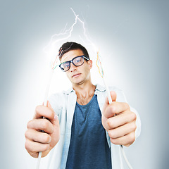 Image showing Man, glasses and wires for cable in studio for electricity, spark or danger mockup on gray background. Portrait, technician or electrician by career for fixing, glitch or 404 on internet, web or app