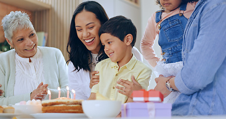 Image showing Child with birthday cake, candles and big family to celebrate with smile, fun and love together in home. Happiness, gift and congratulations, mom and grandparents at kids party with excited children.