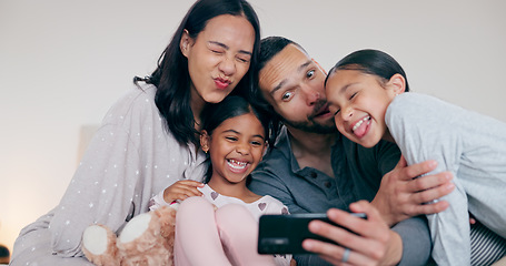 Image showing Funny family selfie, parents and kids in bedroom, hug and bonding together for love or goofy memory in home. Photography, love and mom, dad and children on bed with smile, relax playful fun in house.