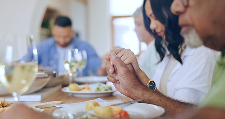 Image showing Home, praying and family with food, lunch and festive celebration with blessing, brunch and thanksgiving. Holding hands, apartment and group of people with religion, ritual and gratitude with worship