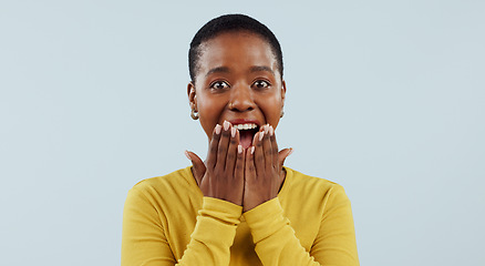 Image showing Happy black woman, portrait and surprise in wow, winning or lucky prize against a studio background, Face of excited African female person smile in joy for bonus, promotion or sale promo in discount