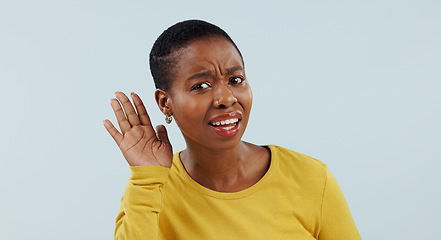 Image showing Listening, confused and whisper with portrait of black woman in studiofor deaf, hearing and news. Communication, quiet and person asking for hand gesture, speaking and secret on blue background