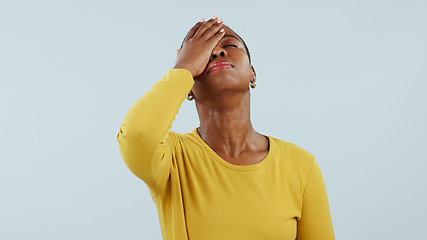 Image showing Frustrated black woman, headache and mistake in fail, stress or anxiety against a studio background. upset or disappointed African female person migraine in depression, burnout or fatigue on mockup