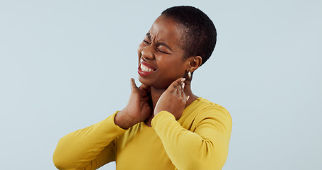 Image showing Black woman, neck pain and injury in stress, pressure or anxiety against a gray studio background. Face of frustrated African female person or model with sore joint, inflammation or ache on mockup