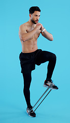 Image showing Man, legs and resistance band in fitness, workout or training against a blue studio background. Male person, athlete or serious model with straps for cardio exercise, endurance or stamina on mockup