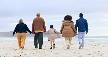 Image showing Happy family, walking or holding hands by beach, nature or support love to relax on calm holiday. Parents, kids and generations of care in marriage, vacation and rio de janeiro for health wellness