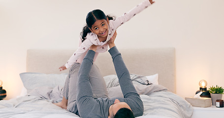 Image showing Father, daughter and bed in home for plane game, bonding or love with care, support and balance. Dad, girl child and happy for playing airplane in bedroom for trust, relax or together in family house