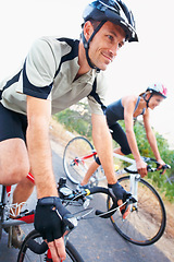 Image showing Happy, couple and cycling on road in nature for cardio, fitness and training on bicycle together. Outdoor, people and exercise on bike for fun, workout and travel in countryside adventure or journey