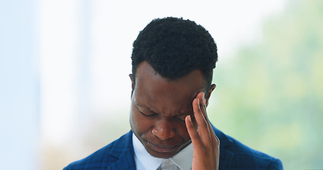 Image showing Business, man or headache in office with stress, burnout or risk in corporate company from migraine. Black person, employee or entrepreneur and tired, anxiety or discomfort from strain at workplace