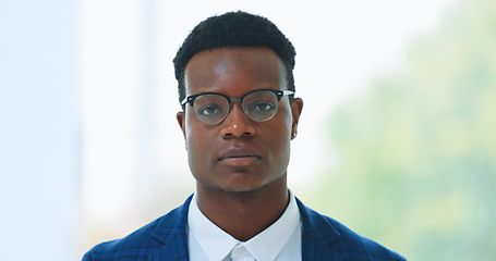 Image showing Portrait, glasses and serious with business black man in an office for corporate of professional work. Face, mission and mindset with a young employee in a workplace for growth or company development