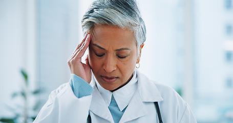 Image showing Doctor, woman or headache in office with burnout, stress and risk at hospital or clinic from migraine. Mature person, employee or professional with fatigue, anxiety or discomfort from strain at work