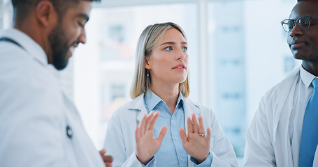 Image showing Group conversation, doctors meeting or woman planning, brainstorming or collaboration in medical clinic. Communication, leader or team surgeon, nurses or expert consulting on problem solving solution