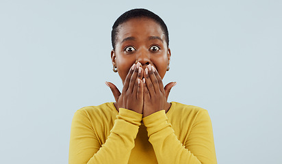 Image showing Woman, shocked and surprise or cover mouth for gossip, news of sale, announcement or information in studio. Portrait of african person with wow or excited for story or secret on a white background