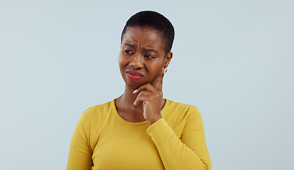Image showing Thinking, confused and black woman in studio with why, brainstorming or asking solution on grey background. Questions, doubt and African model with emoji gesture for problem solving, how or forget