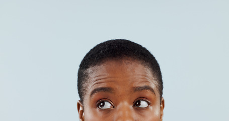 Image showing Thinking, space and eyes with woman in studio for mockup, planning and opinion idea. Question, why and confused with closeup face of african person on grey background for guide, remember and choice