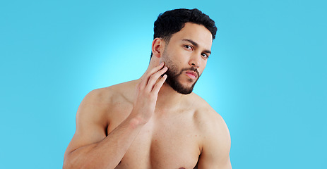 Image showing Man, portrait and beard in grooming, skincare or hygiene isolated against a blue studio background. Face of handsome or attractive male person or model in beauty, facial cleaning or routine on mockup