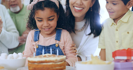 Image showing Child with birthday cake, candles and happy family to celebrate with smile, fun and love together in home. Care, gift and congratulations, mom and grandparents at kids party with excited children.