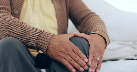 Image showing Hands, knee pain and senior man on a sofa with arthritis, fibromyalgia or osteoporosis closeup. Legs, problem and zoom of elderly person with massage for relief from inflammation, injury or joint