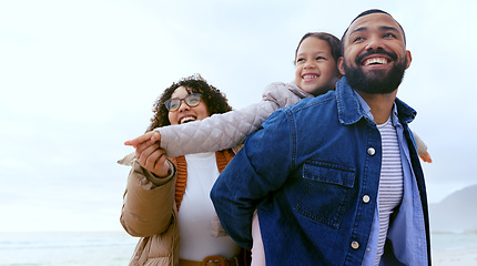 Image showing Happy family, piggyback or airplane game by beach, nature or support love to relax on calm holiday. Young man, woman and child with bond for care, marriage and vacation in rio de janeiro for wellness