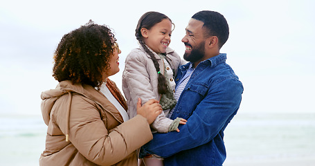 Image showing Happy family, hug child and love by beach, nature or support to relax on calm holiday. Young man, woman and daughter with bonding for care, marriage and vacation in rio de janeiro for peace wellness