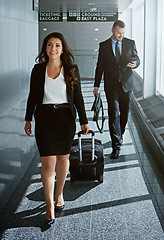 Image showing Walking, journey or business people in airport with suitcase, luggage or baggage for a global trip. Smile, happy woman or corporate workers in lobby for travel or transport on international flight