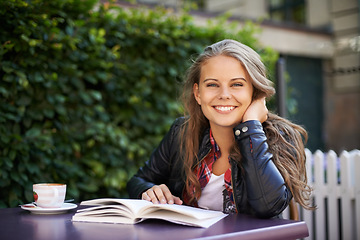 Image showing Happy woman, portrait and reading a book at cafe, outdoor and coffee shop with espresso, latte or beverage. Girl, smile and relax with green tea, drink or english literature in morning at city bistro