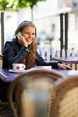 Image showing Portrait, happy woman and phone call for communication, outside or cafe in Paris, travel or trip. Young, person or student with mobile for holding, conversation and talk with laugh for funny joke