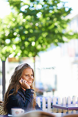 Image showing Happy, phone call and woman outdoor at cafe in summer to relax with espresso, latte or beverage. Girl, smile and sitting or talk at coffee shop in morning with cellphone, communication or contact