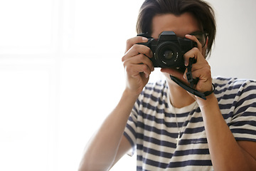 Image showing Man, camera and photographer with vision, creative and art in apartment, pictures and inspiration. Male person, confident and photography or lens, vintage technology and retro equipment or gadget