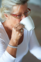 Image showing Mature, woman and coffee for morning breakfast in home for relax rest, espresso for calm. Female person, hot drink or cup for peace as holiday casual or break for senior love retirement, latte in mug