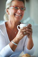 Image showing Mature, woman and coffee smile at lunch for retirement relax or happy in home or bread snack, espresso for rest. Female person, hot drink or cup breakfast meal as muffin for hungry, eating on holiday