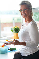 Image showing Senior, woman and portrait dish vegetables for lunch meal for holiday food, retirement relax in home. Female person, face and smile for eating healthy vitamin or nutrition, kitchen counter at brunch