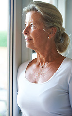 Image showing Senior, woman and thinking of nostalgia in home with smile for fond memory, peace or happiness. Elderly person, looking and window with relaxed expression on face for wellness, care and retirement