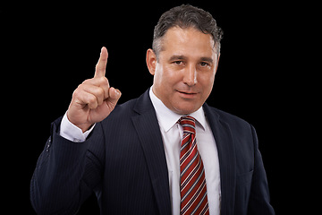 Image showing Pointing up, business and man with promotion, portrait and professional on dark studio background. Mature person, mockup space or entrepreneur with a decision, choice or announcement with opportunity