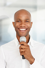 Image showing Black man, microphone and portrait with smile, speech and working at event, happy and employee. Speaking, career and workplace for corporate seminar, speaker and hosting for business conference